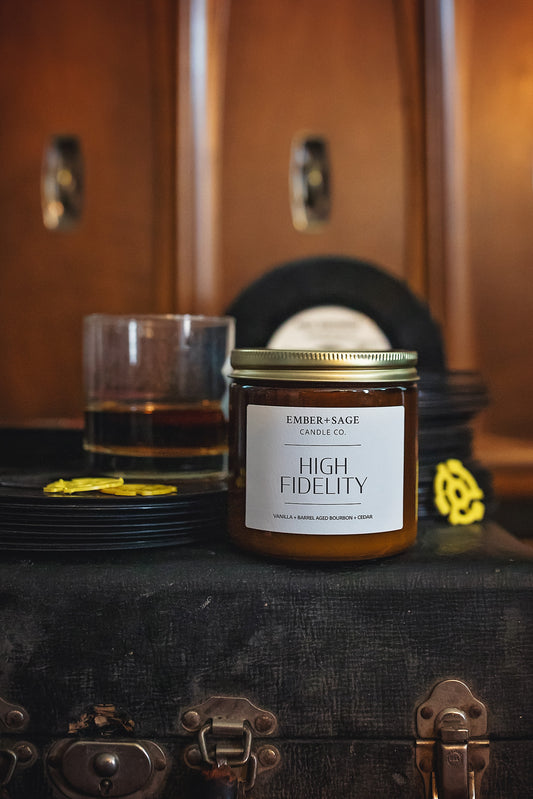 High Fidelity hand-poured soy/coconut Nebraska candle, vanilla, bourbon, cedar scent, on a wind-up phonograph case with 45s vinyl records, spindle adapters, whiskey and 1960s turntable console